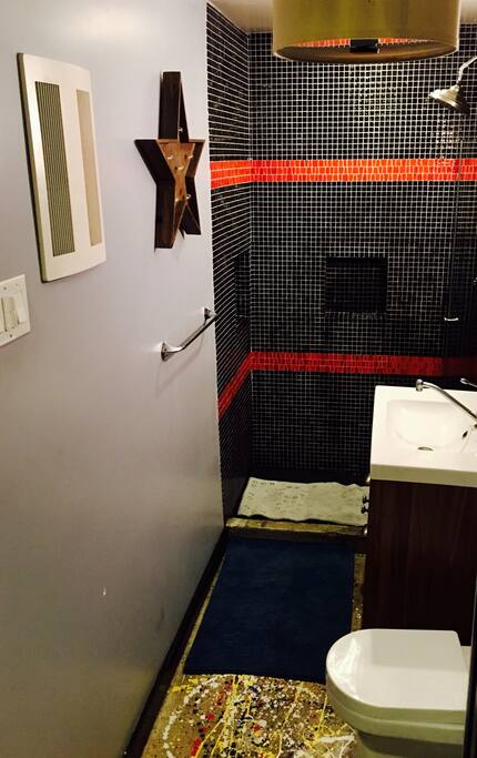 Walk-in shower, modern fixtures, linens provided.