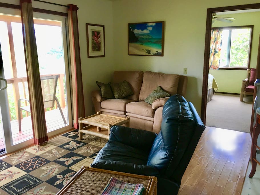 Living room with recliner, love seat, TV with cable and hi speed wifi.