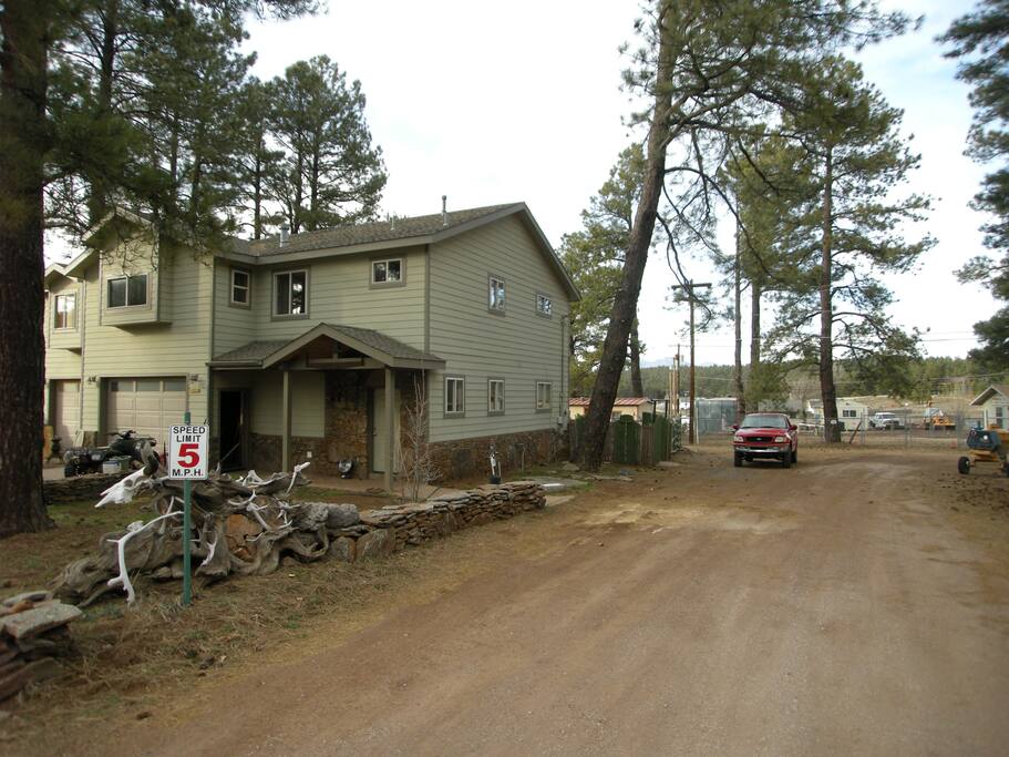 Front of the home from road (Airbnb guest will park and enter where the red truck is parked).
