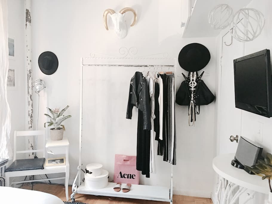 BEDROOM: FULL USE OF CLOTHING RACK + HANGERS + WALL HOOKs. Great for those who overpack. :) WALL MOUNTED TV EXTENDS OUT FROM WALL AND CAN BE VIEWED FROM VARIOUS ANGLES. (Any of my personal items are only shown for photo purposes and will be cleared out for guest(s)