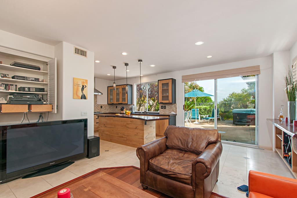 Seating surrounds the 58” flat screen TV in the living room