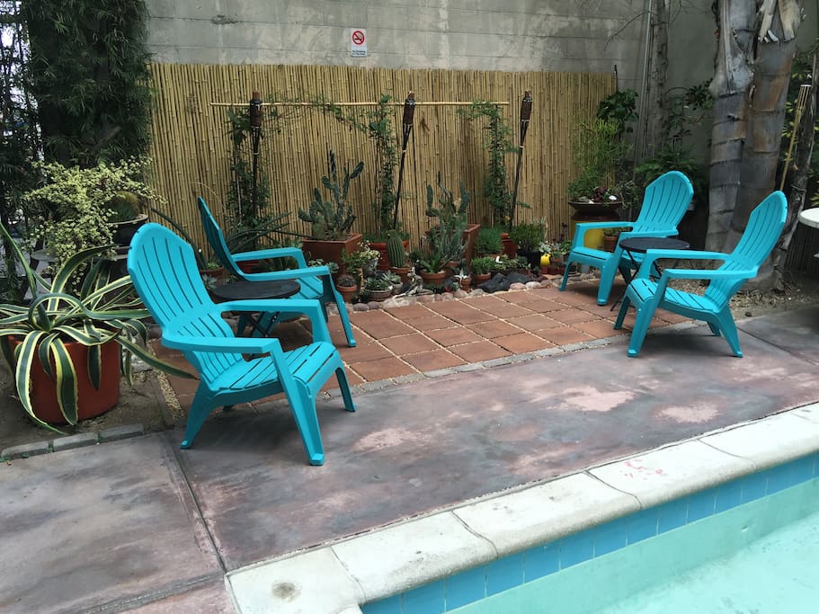 Community jacuzzi area with lounge chairs and garden area for building which is steps from my loft space.