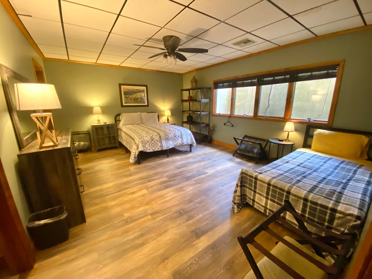 Lower level bedroom with queen and twin bed along with a twin in the nook shown in next pic 