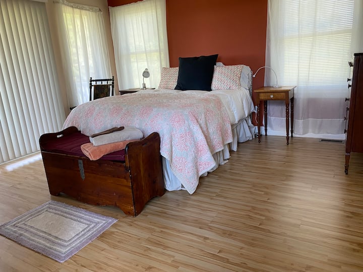 The master bedroom has an adjustable queen bed, slider access to porch and prive bath with tub and shower. This room is on the first floor near the living room. 