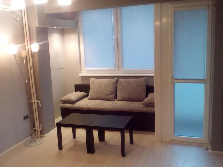 Seating/sleeping area, double bed.