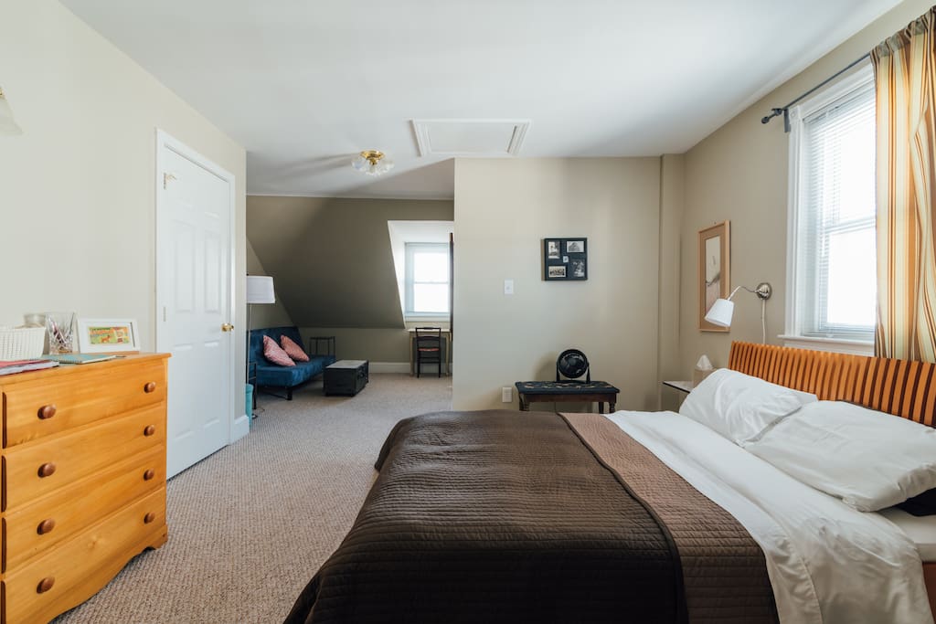 L shaped suite with sitting and reading area and futon. Additional nook for air mattress not shown