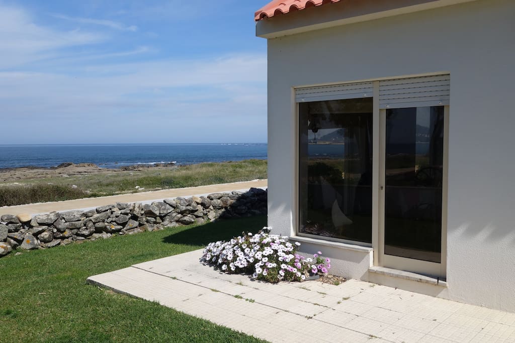 Window's house on the rocks of Moledo beach