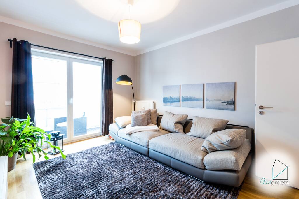 The cozy sofa invites you to relax after a long day in the capital.