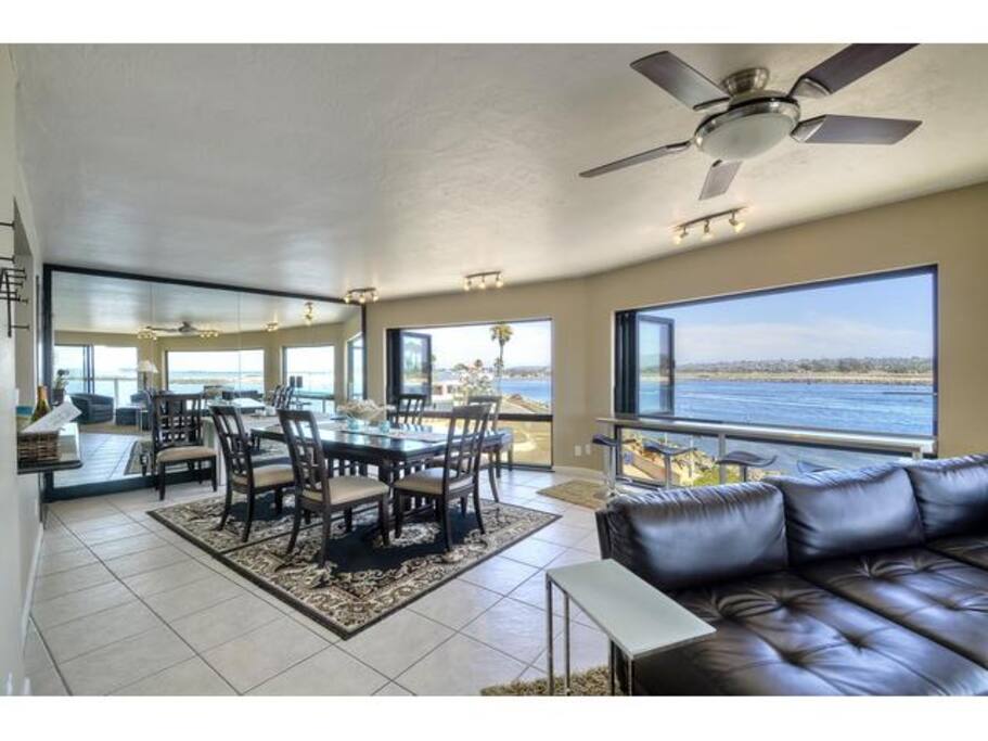 Dining area with panoramic views of the Jetty, Mission Bay, and Pacific Ocean