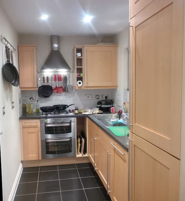 Full kitchen with gas hob and electric oven/grill and extractor fan