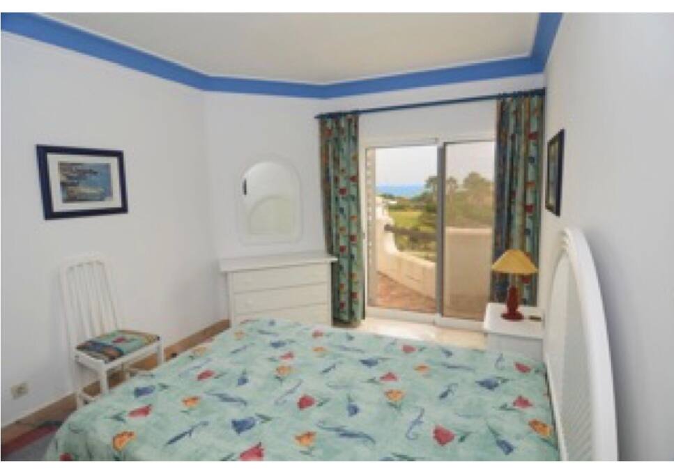 Sunny bedroom with sea views