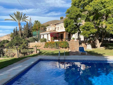 Villa with a swimming pool, paddle tennis court, and private garden