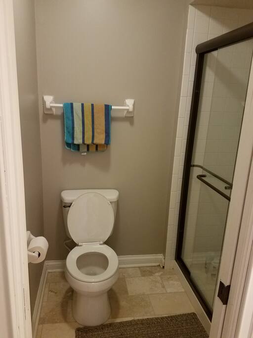 Jack & Jill bathroom with private toilet & shower with lockable sliding door.