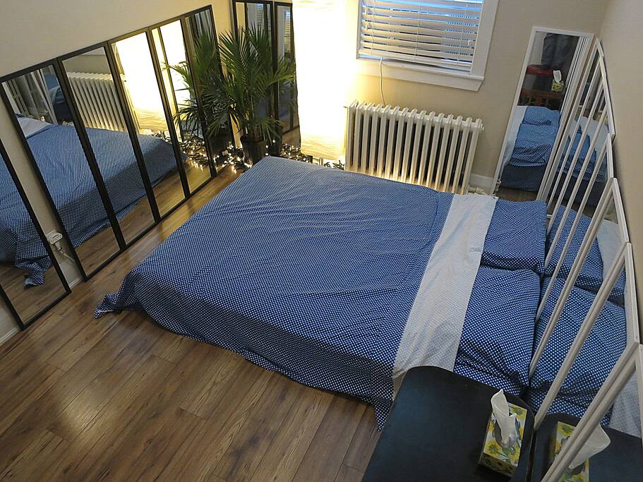 Bedroom with a floor queen mattress