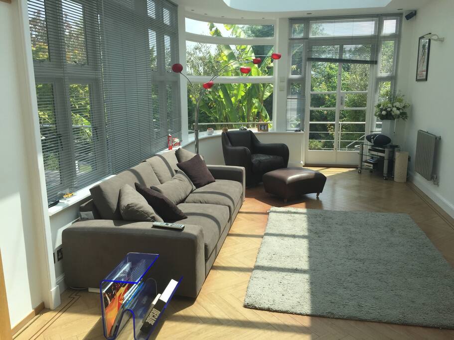 Main reception area/garden room. contemporary and very bright spacious room. Patio door access to rear garden.