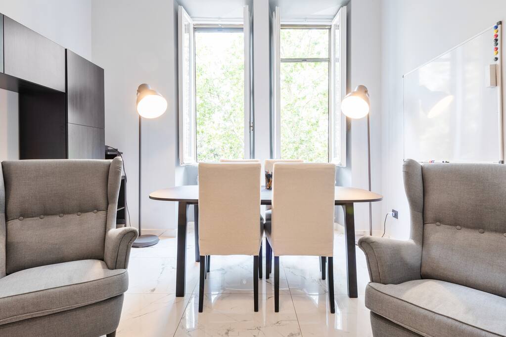 Living room, comfy armchairs, bright big table with park view, whiteboard