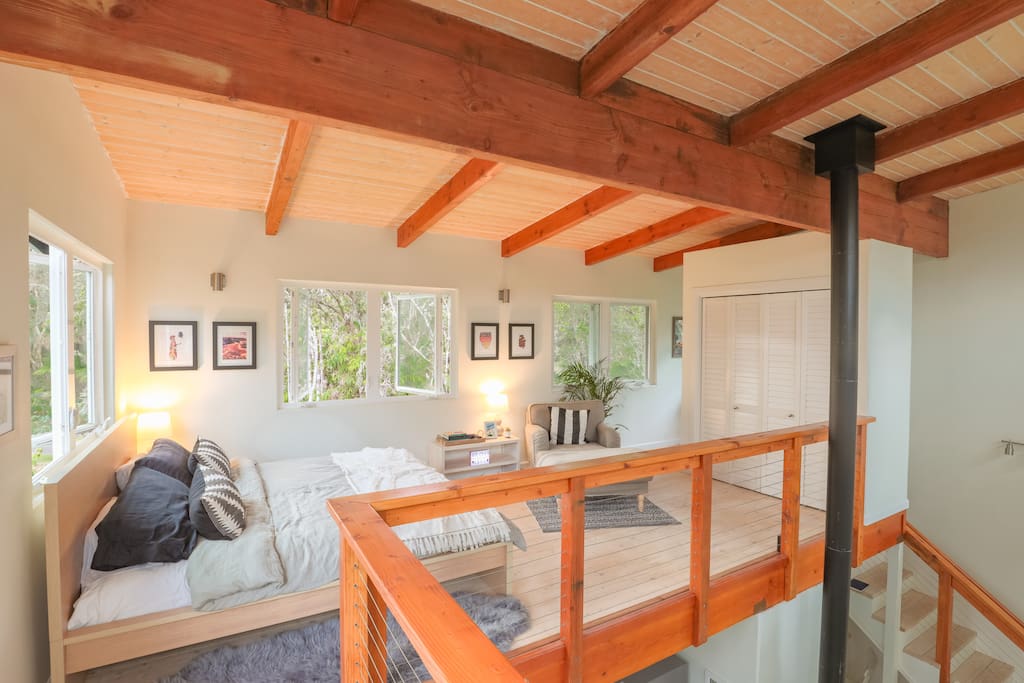 Open air loft on the 3rd floor, located at tree level with the Hawaiian Volcano Rainforest, enjoy high ceilings, plush king size bed, and large closest to store your belongings.