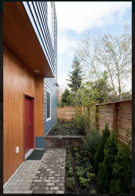 Greenery welcomes you to the private, first-floor entrance