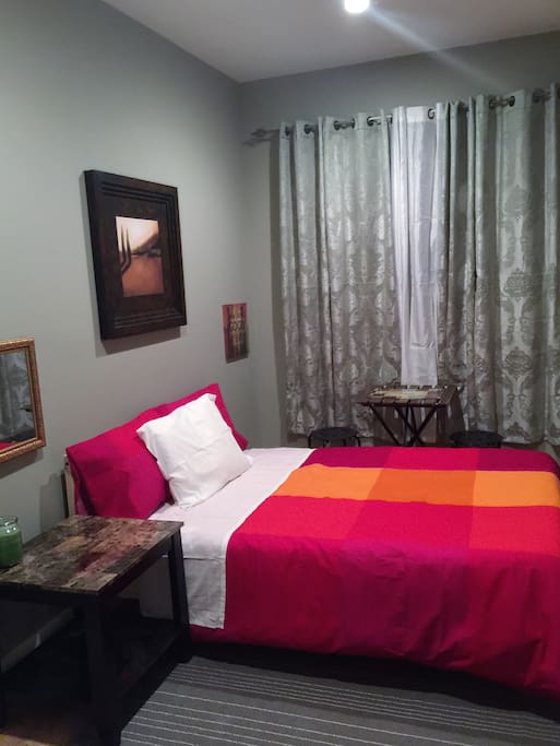 Very nice standard room for two. Comes with Full size bed, a smart tv, standard closet and dresser. This room also has a table and two chairs comfortable enough to have a meal inside. The house with four bedroom comes with two full bathroom to share. The house have a living room and a kitchen that can be use by the guest.