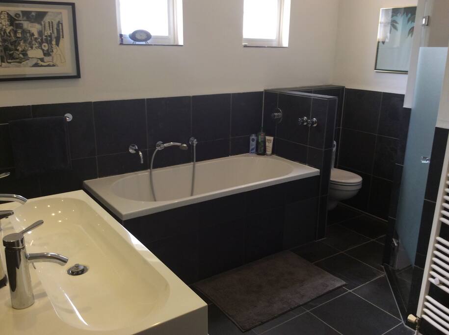 Bathroom with bath and shower