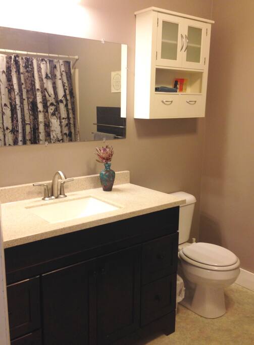 Your private bathroom, complete with towel warmer and shower/bath combo.