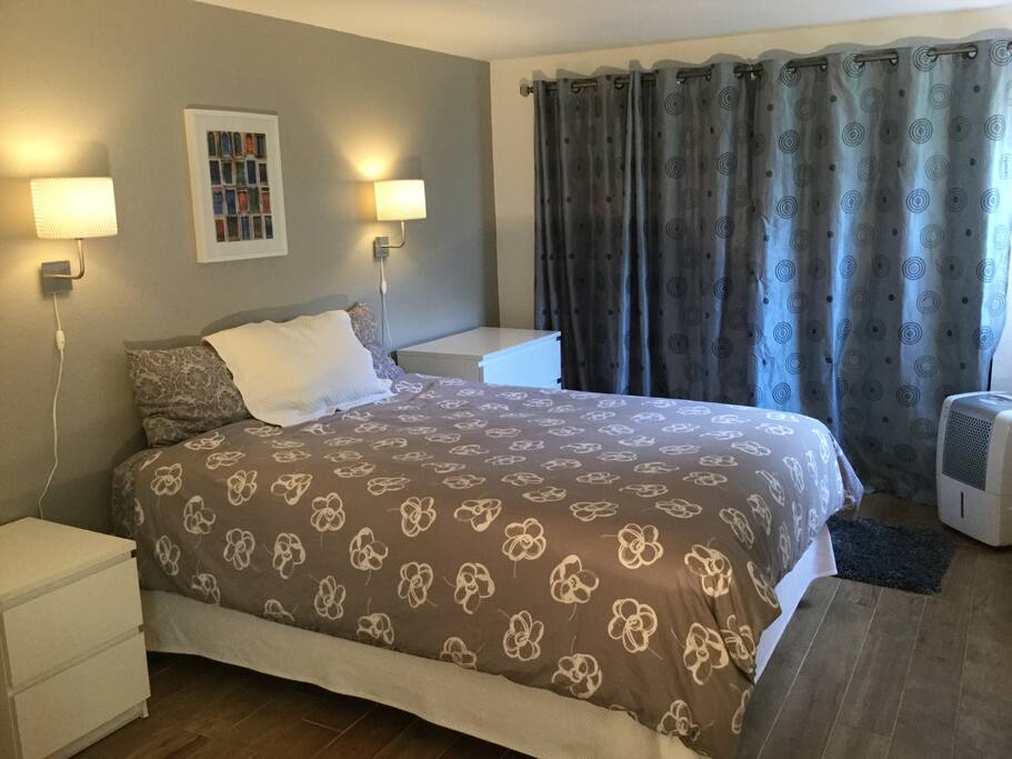 Bedroom with reading lamps.
