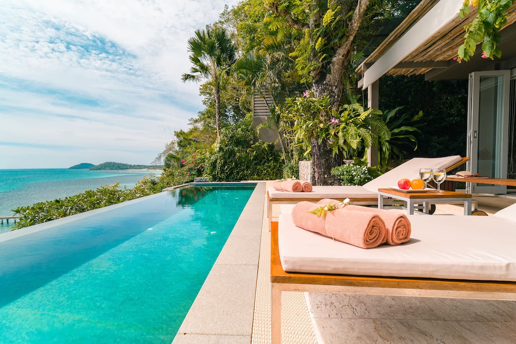 Relaxing beside the Headland Villa 3 infinity pool