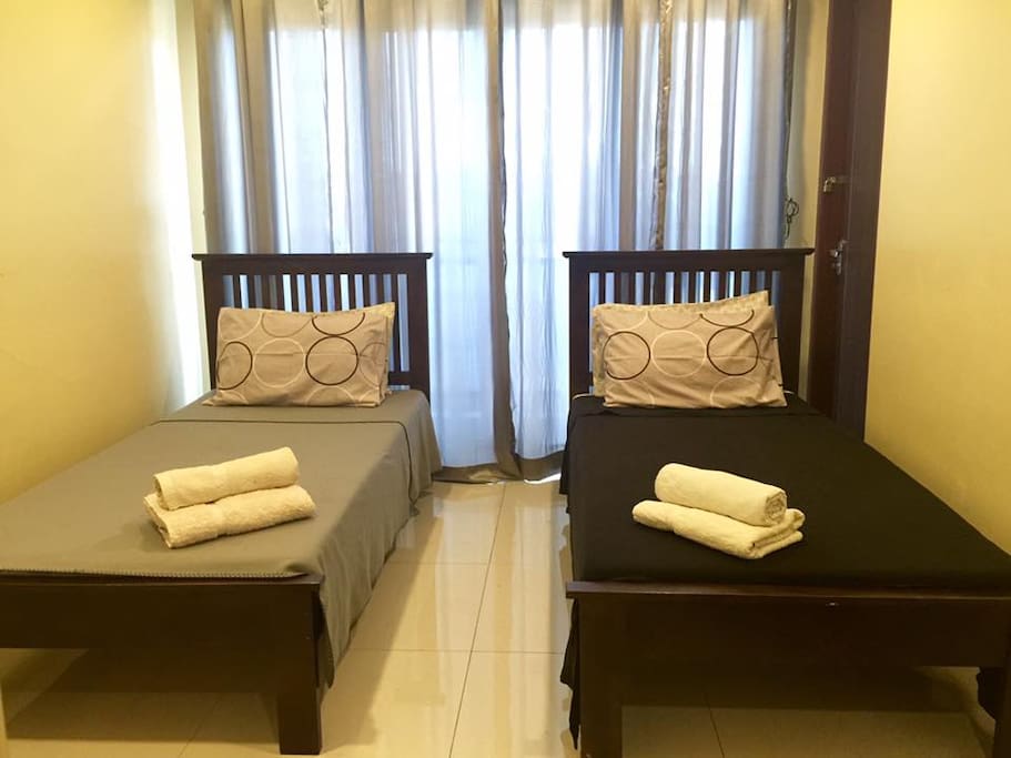 2 Single Beds with 2 extra matress kept under the beds