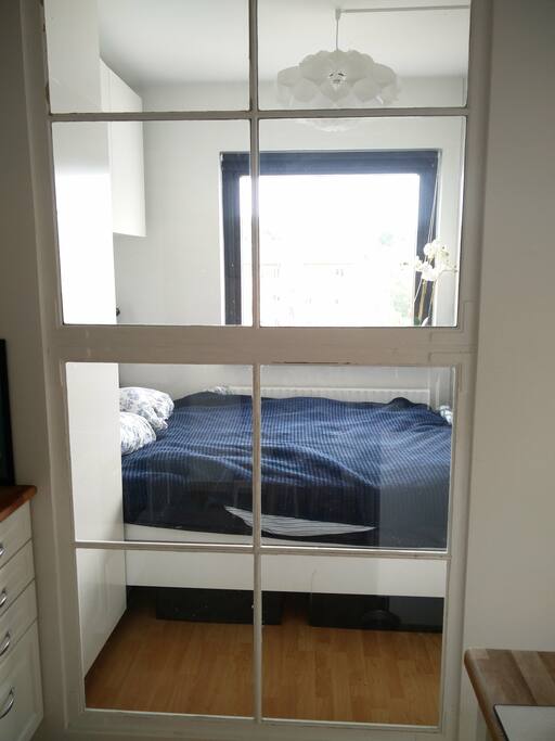 View of the bedroom from the kitchen.