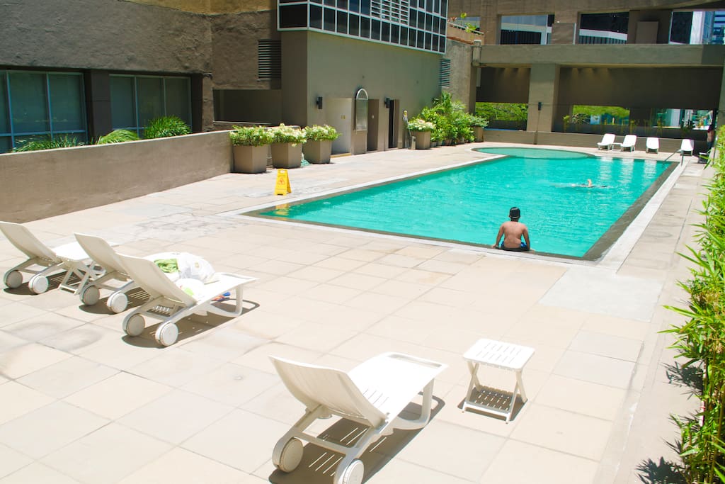 Outdoor pool with sun beds