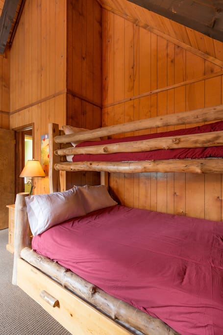 Upstairs bunk room features twin over full bed with a twin trundle. Sleeps four!