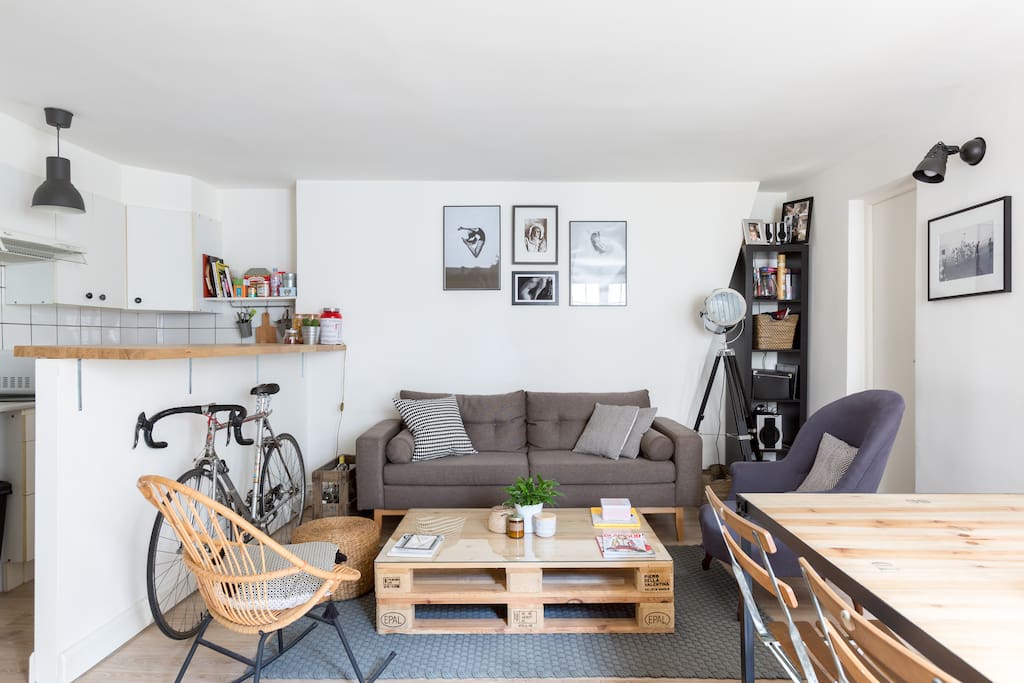 Our cute living room with a couch, 1 large dining table...