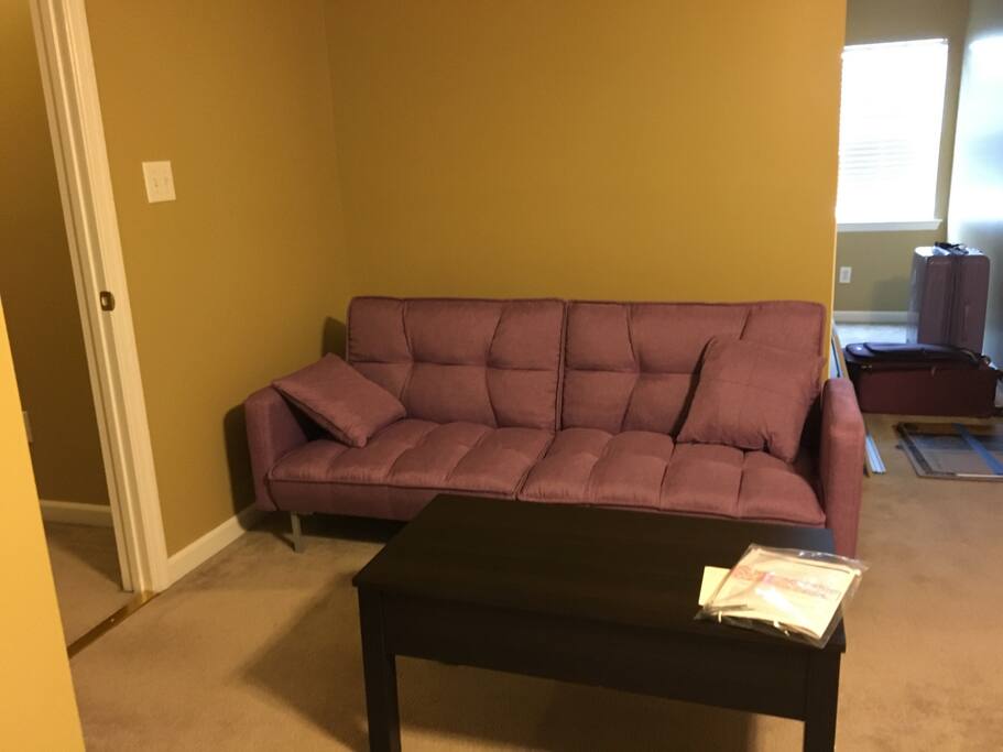 Upstairs bedroom with futon. Lots of extra space for air mattress as well. Private bathroom attached.