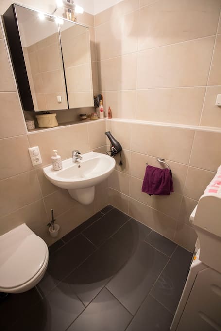 Bath room with floor heated comes with hair dryer, soap and towels.