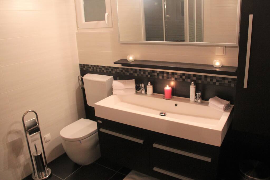 Bathroom with shower cabin and double sink