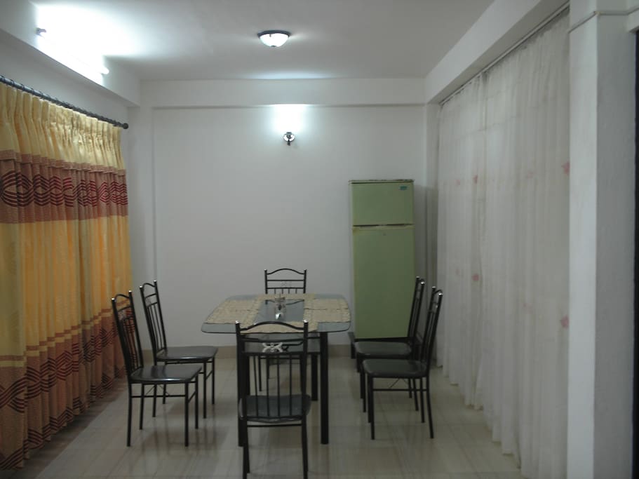 Neat and clean dining hall with dining table.