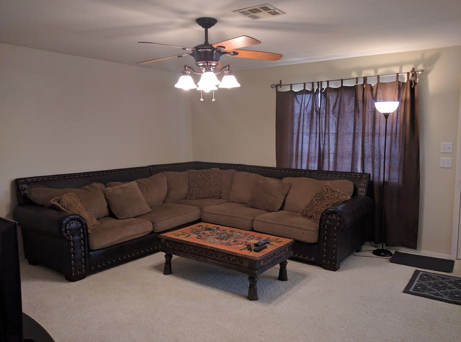 Comfortable and large sofa can be used as a bed for a 5th guest.