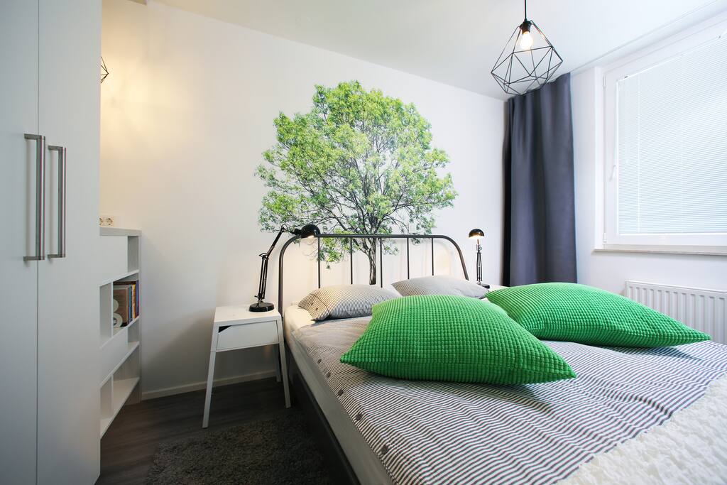 Comfy king size bed with high quality mattress for your sweet dreams. Blackout curtains will let you sleep in without waking up by daylight.
