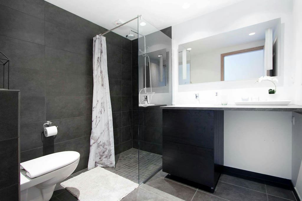 The bathroom includes a washing machine (not present in this picture)