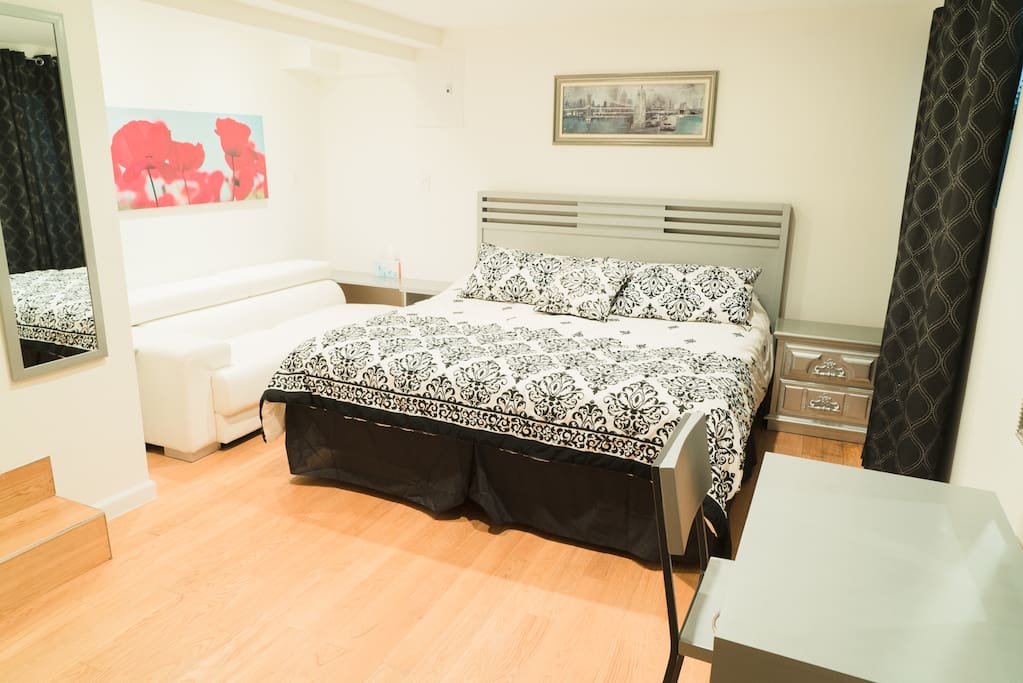Master bedroom en-suite with King Size bed, couch and Smart TV for your enjoyment.