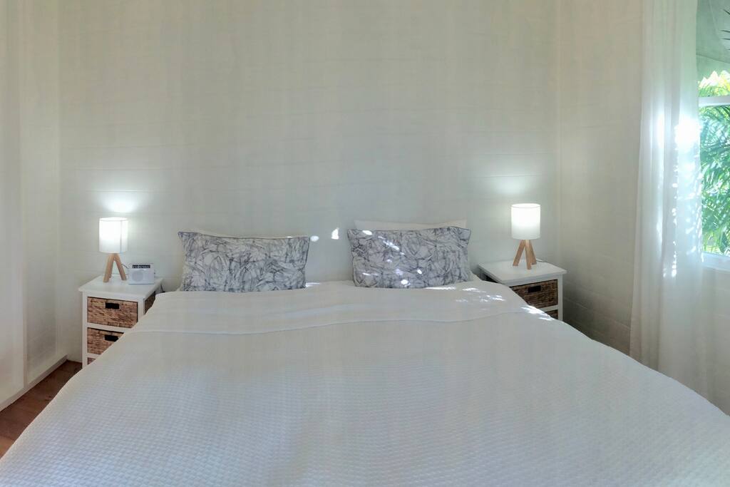 King-size bed with built in wardrobe, bed side storage and adjoining private living area