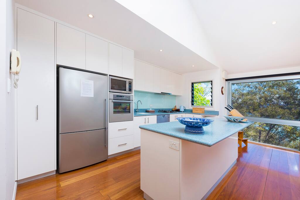 The kitchen is very well equipped with stunning 180 degree water views