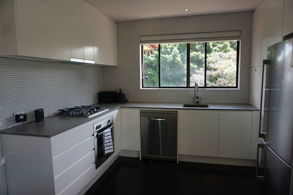 designer kitchen with brand new appliances