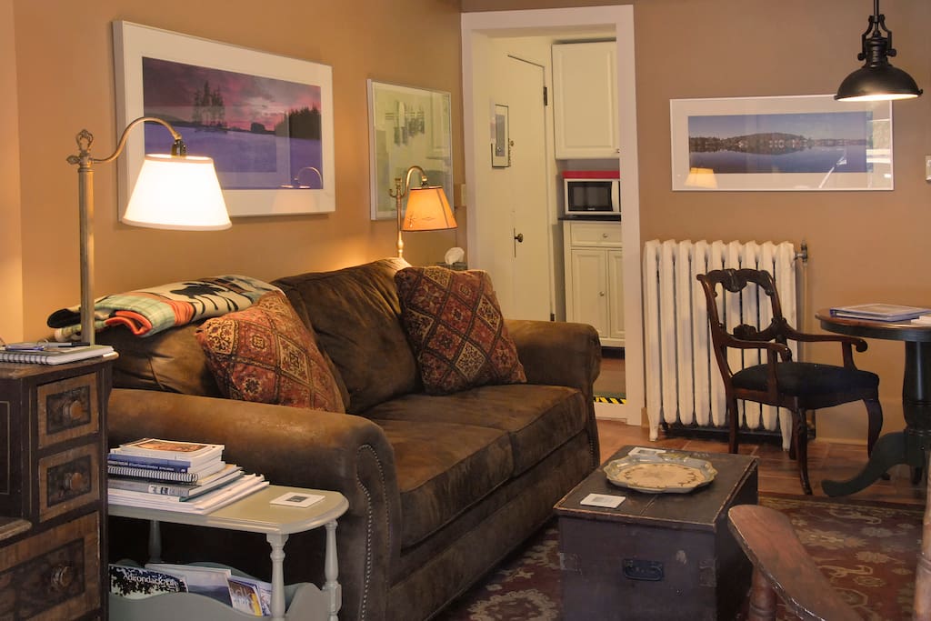 Here's the living room with its comfortable queen-size sofabed and Adirondack artwork, which is found thoughout the apartment.