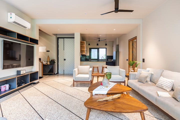 Relax and unwind in our opulent living room, with its plush furnishings and stunning décor.