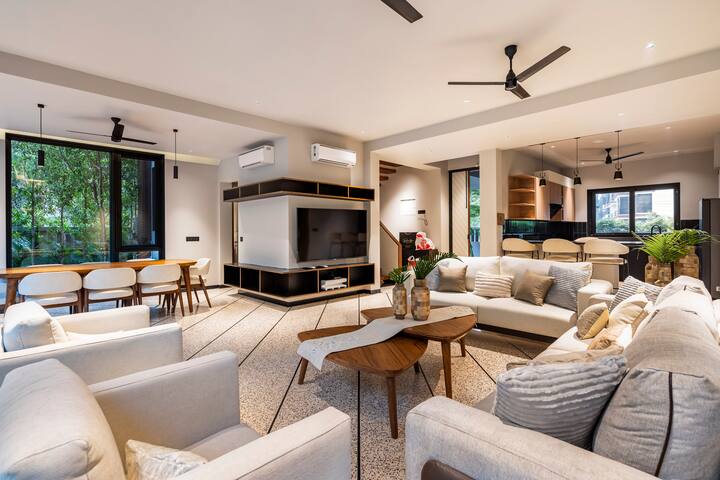 Sink into our plush chairs and let your worries melt away in our luxurious living room.