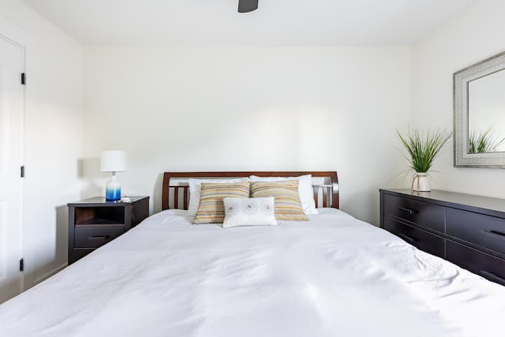 First guest bedroom with a California King-sized bed.