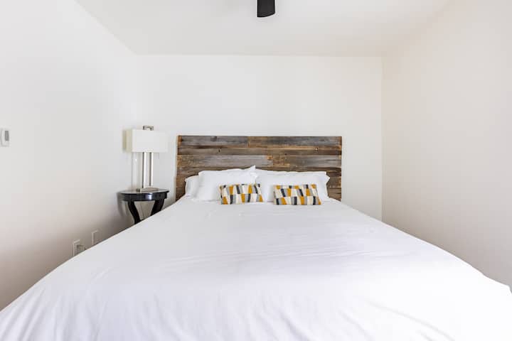 Primary bedroom with California King-sized bed and en-suite bathroom.