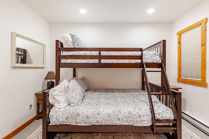 Lower bunk is a full size bed. Upper bunk is a twin size bed. The bed is very sturdy. This room is in the lower level and has 2 windows that look out to the grass and creek.