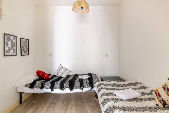 Two single beds in the living room